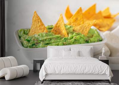 Bowl of guacamole with tortilla chips Wall mural