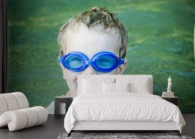 boy in swimming goggles on the river Wall mural