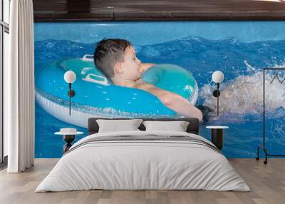 A Beautiful happy boy to swim in the pool Wall mural