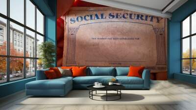 A U.S. Social Security card in the palm of a hand. Wall mural