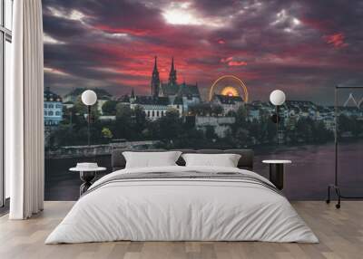 Burning sunset over the Rhine and Münster in Basel, Switzerland during the Autumn Fare Wall mural