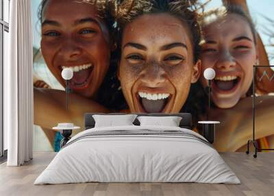 A group of women standing together on a sunny beach, great for lifestyle or travel imagery Wall mural