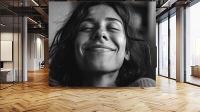 A happy woman smiling in a black and white photo Wall mural