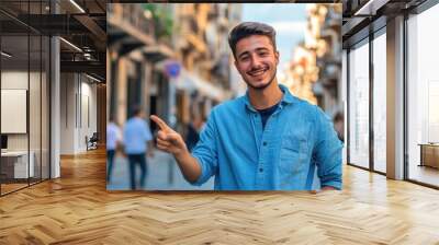 A person standing on a busy urban street, dressed in blue shirt Wall mural