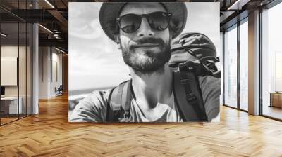 A person with a hat and sunglasses taking a photo of themselves using a camera Wall mural