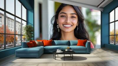 Woman with long black hair and earrings Wall mural