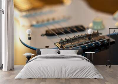 Close up of the electric guitar bridge in a sunrise light. Wall mural