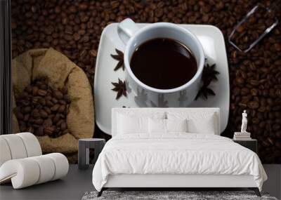 Coffee cup and coffee beans on black background Wall mural