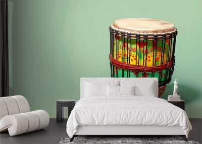 Colorful drum on light green background Wall mural