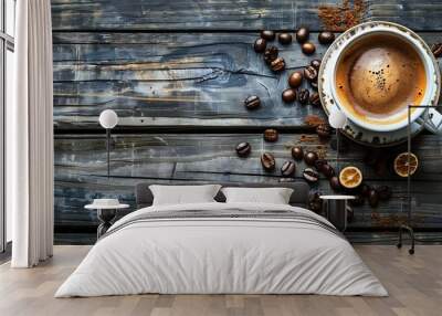 Cup of fresh coffee with coffe beans around it on old wooden table Wall mural