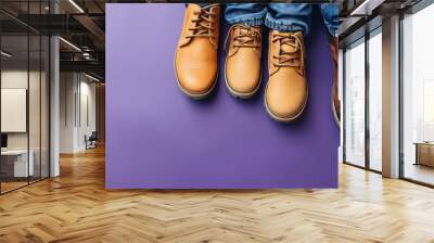 Father and son shoes together on purple background Wall mural