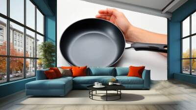 frying pan with hand on white background
 Wall mural