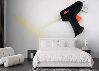 glue gun and glue sticks on white background Wall mural