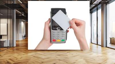 payment with NFC tecnology credit card on pos terminal in woman hands isolated on a white background Wall mural