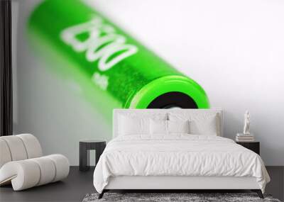 Green AA battery 2500 milliampere battery on a gray background Wall mural