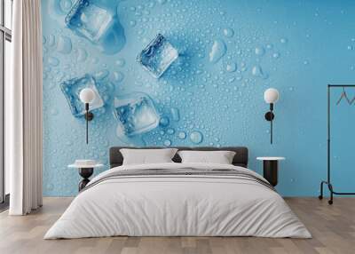 Ice cubes with drops of melt water water on a blue background, top view. Wall mural