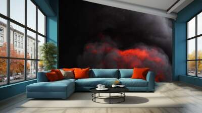 Flames of red fire and motion blur dramatic clouds of black smoke covered sky Wall mural