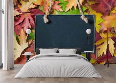 Chalkboard  on autumnal leaves Wall mural