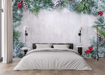 Christmas and New Year background with fir branches and snowfall on wooden white board Wall mural