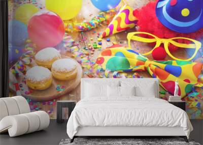 Colorful carnival or party background with donuts, balloons, streamers and confetti and funny face Wall mural