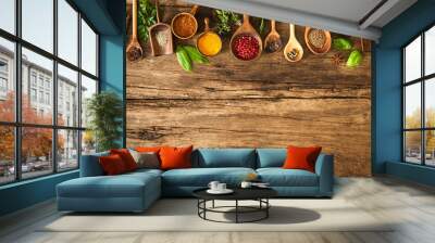 Colorful spices on wooden table Wall mural