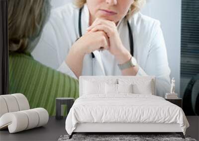 doctor explaining diagnosis to his female patient Wall mural