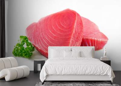 Fresh tuna fish fillet steaks garnished with parsley isolated on white background Wall mural