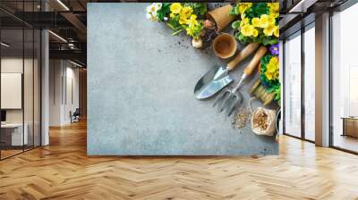 Gardening tools and spring flowers on the terrace Wall mural