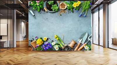 Gardening tools and spring flowers on the terrace Wall mural