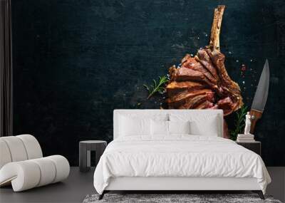 Grilled dry aged tomahawk steak sliced as close-up Wall mural