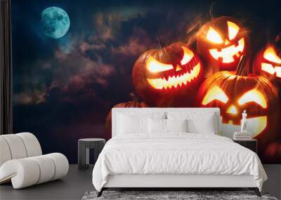 Halloween pumpkin head jack lantern with burning candles Wall mural