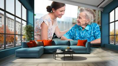 senior woman with her home caregiver Wall mural