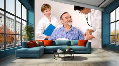 Two doctors with a patient Wall mural