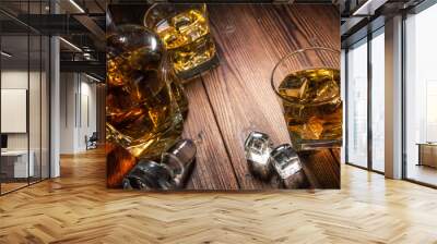 Two glasses of whiskey with ice on wooden table Wall mural