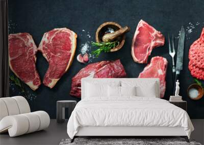 Variety of raw cuts of meat, dry aged beef steaks and hamburger patties Wall mural