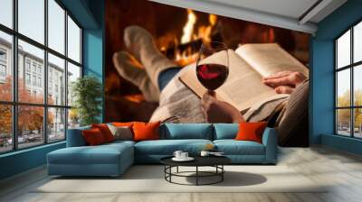 woman reads book near fireplace Wall mural