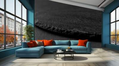 Round empty black plate from slate stone close-up. dark textured cement background Wall mural