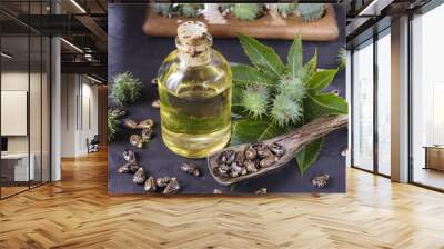 beans and castor oil on the black table Wall mural