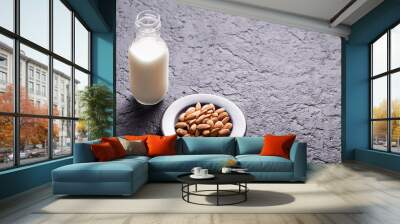 milk and almond seeds (Prunus dulcis) close-up image Wall mural