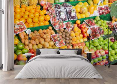 pile of fruits on the shelf of a Colombian market Wall mural