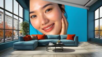 Skin care background with beautiful smiling asian girl model isolated Wall mural