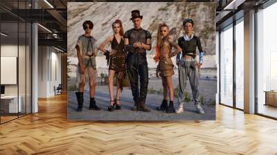 three guys and two girls in fantasy cosplay clothes on a post-capitalist background Wall mural