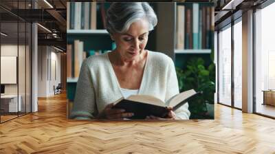 Woman Reading a Book in a Library Wall mural