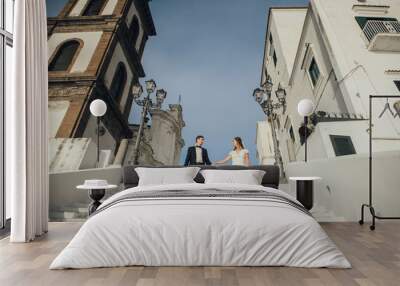 Young wedding couple having fun Time  in Italy. Wall mural