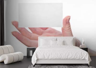 Empty business card in woman's hand Wall mural