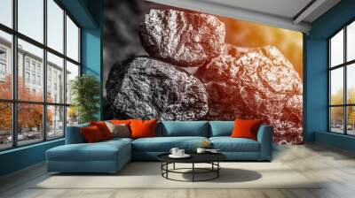 Coal mining industry. Natural black coals for background. Coal in the miner  hands. Volcanic rock. Wall mural