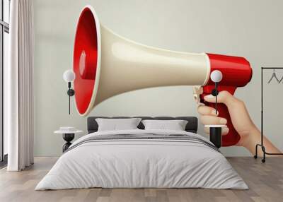 A hand holding a bright red megaphone, ready to make an announcement or call out loud. Wall mural