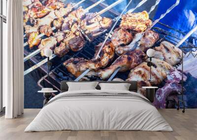 Grilled kebab cooking on metal skewers Wall mural