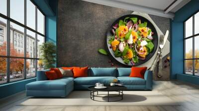 Detox salad with tangerines, mozzarella, herbs, pomegranate seeds and nuts on a dark background. Free copy space. Top view. Wall mural