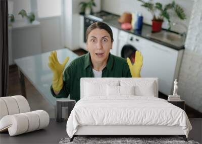 Furious Woman in Yellow Gloves Shouting in Kitchen at Home Wall mural